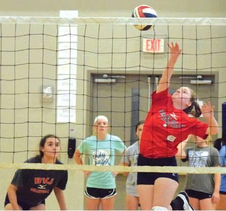BUMP, SET, SPIKE DRILLS were a part of a volleyball clinic in Snook. Olympic gold medalist and World Champion volleyball player Patrick Powers hosted the clinic. -- Tribune photo by Denise Hornaday