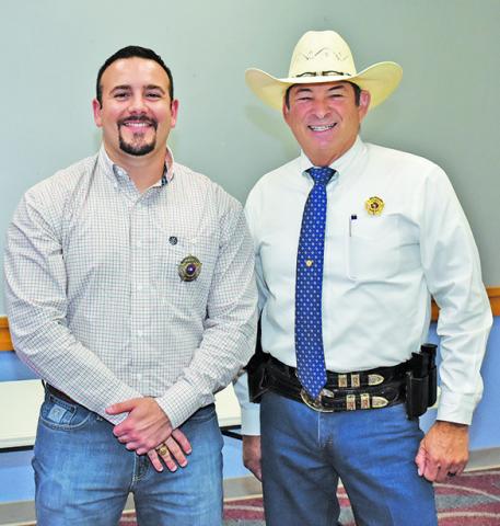 BERN COLLUM III is joined by Sheriff Bill Rios after being sworn in on Monday.