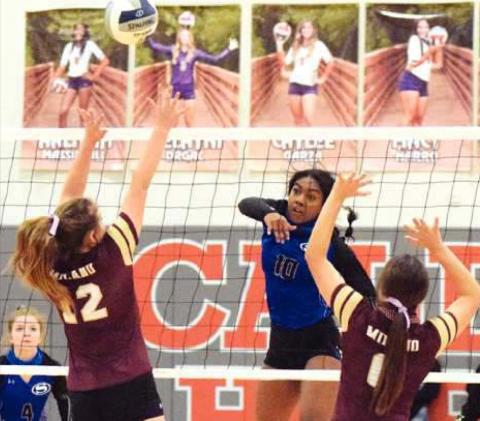 SNOOK’S JAIVAN STRINGFELLOW gets one of her 12 kills during the Lady Jays’ bi-district win over Milano last Thursday night in Caldwell. Also pictured are Snook’s Kamree Walker and Milano’s Montgomery Popham and Toni Meyer. -- Tribune photo by Denise Hornaday