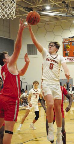 CADEN ZBORIL LEAPS high for this shot last Friday against Bellville. The Hornets lost their last home game 69-49. Tribune photo by Denise Squier