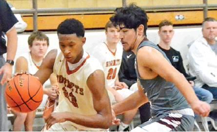 LARRY DAVIS OF Caldwell dribbles the ball last Friday against New Waverly in Caldwell. The Hornets lost 49-42, and they will compete this week at the Rosebud-Lott Tourney. -- Tribune photo by Roy Sanders