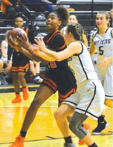 SOMERVILLE’S XADRIA MARTIN drives to the hoop with Moulton applying some pressure. Moulton edged the Lady Yeguas in their season opener 34-32. -- Photo courtesy of the Shiner Gazette