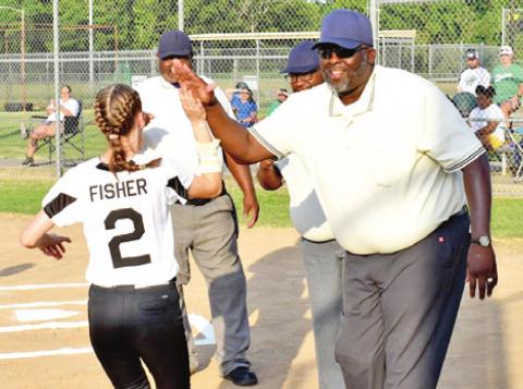 THE UMPIRES WELCOME the players from both teams onto the field prior to Monday’s Columbus-Hempstead softball game.
