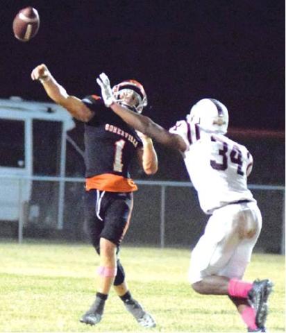 SOMERVILLE’S PHILIP HABA throws the ball away from Flatonia defender Dakory Willis during the Yeguas’ loss to the Bulldogs Friday night at The Rock. -- Tribune photo by Denise Hornaday