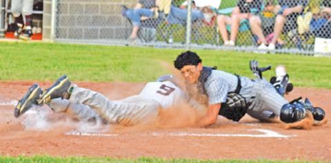 CATCHER VICTOR OROZCO tags this Iola base runner at home in the Yeguas final home game. -- Tribune photo by Roy Sanders