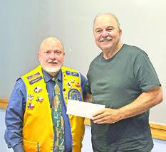 KEN WILTZ, President of the CBC Lions Club, presents a check for $2,500 to Mike Patranella, representing the Caldwell Boys and Girls Club. Photo courtesy of the Lions Club