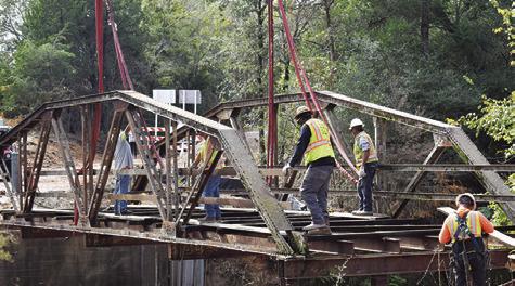 TAKEN JUST MOMENTS before the bridge was removed, this is the final photo of the old iron bridge intact at County Road 146.