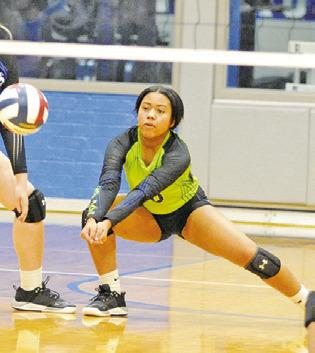 ALANA STRINGFELLOW dives to bump the ball during the Snook-Fayetteville match last Friday. -- Tribune photo by Denise Squier