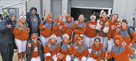 THE LADY HORNETS CELEBRATE their win over Tidehaven on Saturday after a cold day at Lady Hornet Field. Caldwell was one of the sites for the 2024 Texas High School Softball Leadoff Classic which was put on by the National Fastpitch Coaches Association.