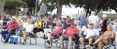 RESIDENTS FROM ACROSS THE COUNTY brought their lawn chairs to listen to People’s Choice Band from Austin at last Saturday night’s “Summer Concert Series.” Tribune photo by Denise Squier