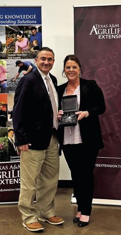 BURLESON COUNTY EXTENSION agent Holly Narro is pictured receiving her District 9 Rising Star award with district extension administrator Eric Zimmerman. Photo courtesy of Holly Narro