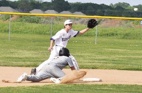 SNOOK’S GABRIEL LaCAZE prepares to catch the ball as Ian Teague slides to second base.
