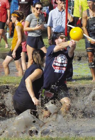 MUD PIT VOLLEYBALL was featured at Saturday’s annual Hog Splash in Snook, a fundraiser for Hospice Brazos Valley. Tribune photo by Denise Squier