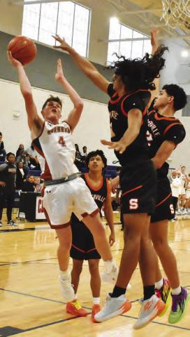 NATHAN SCOTT SHOOTS for Caldwell as Somerville’s Gardner Shivers and Gavin Williams defend. Also pictured is Somerville’s Caleb Hanks. Tribune photo by Roy Sanders