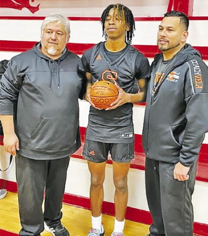 SOMERVILLE’S BRANDYN CARTER IS honored by Head Coach Rene Cantu and Assistant Coach Josh Vela at the Burton game.