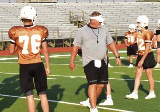 CALDWELL HEAD COACH Sean Witherwax coaches his team during this early practice session. Tribune photo by Roy Sanders