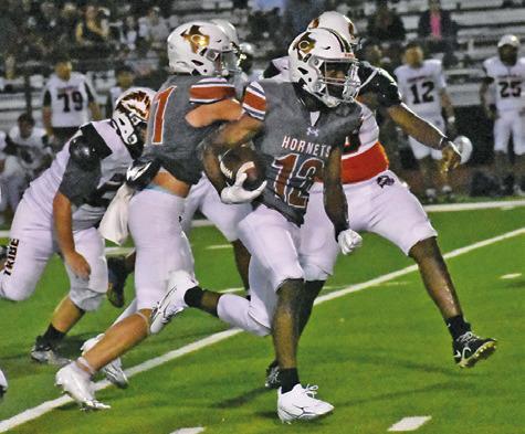 CALDWELL’S DEJUAN MATHIS carries the ball against Somerville. Tribune photo by Roy Sanders