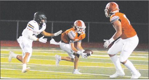 CADEN SCHLUENS MAKES a catch for Caldwell in the homecoming game against Lexington. -- Tribune photo by Denise Squier
