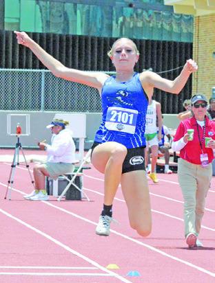 SNOOK’S DAKOTA KIENOW competes in the Class 2A girls triple jump on Friday during the UIL State Track &amp; Field Meet. Tribune photo by Denise Squier