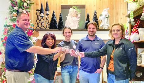 THE BURLESON COUNTY CHAMBER of Commerce is hosting its “Toasting in the ‘Well” beer and wine walk this Saturday. Pictured, from left, are Brian Broaddus, Susan Mott, Kaylee Odstrcil, Stu Chapman and Sharon Livengood. Tribune photo by Sabine Lazo