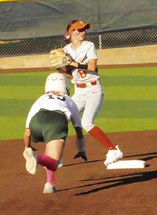 JILLIAN VYKUKAL steps on the bag for an out and checks the runner at first during the Caldwell- Lexington game during this year’s Lady Hornet Softball Tournament.