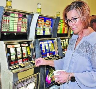 MELISSA BRUNE enjoys the slot machines at last year’s Caldwell Rotary Club Casino Night. The club is gearing up for this year’s event.
