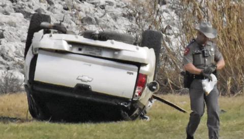 THIS TRUCK IS overturned after a rollover accident on the Lake Somerville Dam road on Saturday afternoon. Tribune photo by Roy Sanders