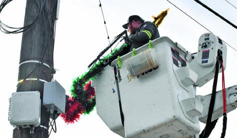 CHRISTMAS DECORATIONS ARE removed by the City of Caldwell on Monday, Jan. 5, in downtown Caldwell. Tribune photo by Roy Sanders