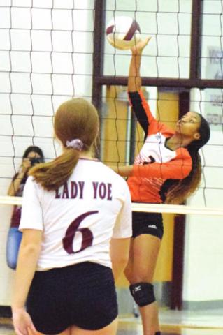 RA’MAYA CARTER hits the ball over the net during Somerville’s match against Cameron Yoe. -- Tribune photo by Denise Hornaday