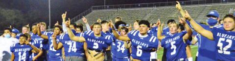 THE SNOOK BLUEJAYS CELEBRATE after winning the bi-district game over Miles at Austin Westlake High School. Snook faces Yorktown next in the Area playoff.