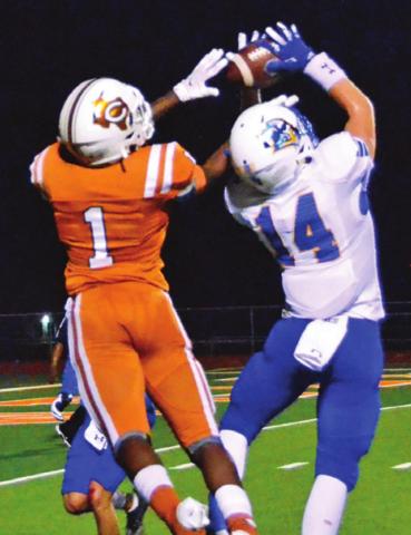 CALDWELL’S JAMAR HEWITT goes for the ball last Friday against Lago Vista. The Hornets fell to the Vikings 20-0 in their annual homecoming game. -- Tribune photo by Roy Sanders