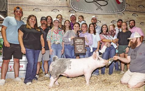 RILEY KOCH EXHIBITED the Grand Champion Swine at the 2025 Burleson County Fair. Also pictured are Colt Hart, Kyt Hart, Matt Hart, Lorin Kieschnick, Jennifer Kieschnick, Kaylynn Kieschnick, Colby Berger, Addie Berger, Bailey Koch, Emily Koch, Mark Koch, Kacie Koch, Judge Cory Raines, Bella Slauson, Kindey Schatte, Burleson County Fair Queen Kodi Hitchcock and Little Miss Taytum Hohlt.