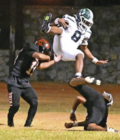 SOMERVILLE PLAYERS DEFEND as this Normangee receiver makes a catch last Friday in Normangee’s 35-16 win at Somerville. Tribune photo by Denise Squier