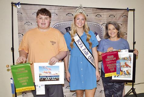 LOGAN GIESENSCHLAG won grand champion for landscape-nature, and Windy Turner won for creative arts. Also pictured is Burleson County Fair Queen Hadleigh Novosad.