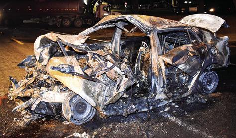 THIS CAR WAS destroyed in the Monday accident on SH 36 South. Tribune photo by Roy Sanders