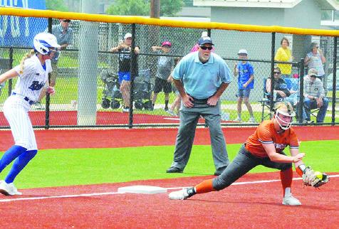 CALDWELL’S CAITLYN FAUST grabs a ground ball to force an out at first base during Game 2 of the Caldwell-Robinson area series on Saturday afternoon at Georgetown High School. -- Tribune photo by Denise Squier