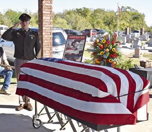 THE AMERICAN FLAG is draped over Quincy Berka’s coffin at his graveside service.