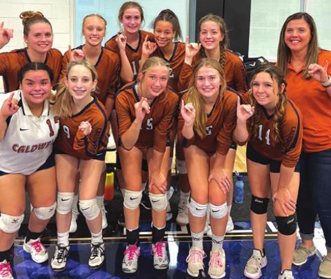 THE CALDWELL LADY HORNET JUNIOR varsity volleyball team celebrates after placing second in the Navasota Junior Varsity Volleyball Tournament over Aug. 27-28.