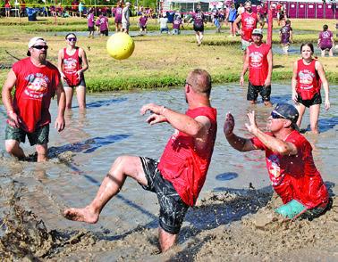 IT’S A FIGHT for the ball last Saturday at Hog Splash 2026 at Slovacek’s, the annual games benefiting Hospice Brazos Valley. Tribune photo by Roy Sanders