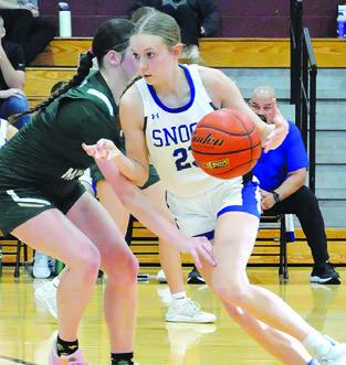 DAKOTA KIENOW DRIVES the lane during the Snook-Valley Mills game at last week’s Thorndale Shootout basketball tournament. Tribune photo by Denise Squier