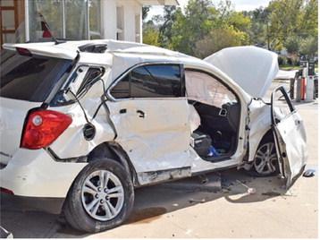 THIS CAR WAS DAMAGED on Friday, Nov. 14, in a collision with a truck on State Highway 21 near the Thomas Street intersection.