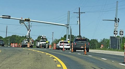TRAFFIC LIGHTS ARE installed on Monday, April 7, at the intersection of F.M. 60 and State Highway 36 in Lyons. Tribune photo by Denise Squier