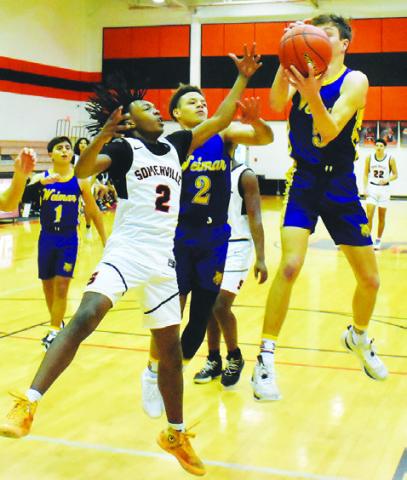 SOMERVILLE’S QUIN GRIMES blocks this Weimar shot in last Thursday’s game in Somerville. The Yeguas won 53-37.