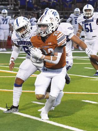 BRAXTON FRITCHER carries the ball for Caldwell in the Robinson game.
