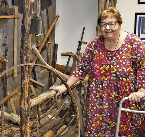 MELYNDA GIESENSCHLAG stands next to this display at the Burleson County Museum at the courthouse. The county will celebrate Heritage Week from March 23-28.