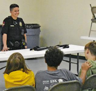 CALDWELL POLICE OFFICER Mary Pierce addresses these fifth-graders on Thursday, May 7, at the Burleson County Ag &amp; Health Safety Day at the county expo center. The event was put on by Burleson County 4-H in conjunction with the Burleson County AgriLife Extension.