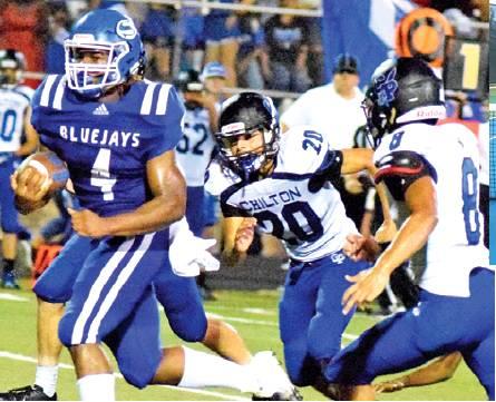 SNOOK’S QWAN YOUNG breaks away from these Chilton defenders for a score last Friday at Allen Academy. The Bluejays lost 34-16 and will face Bartlett this week. -- Tribune photo by Denise Hornaday