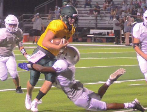 CALDWELL’S LARRY DAVIS makes an open field tackle on a Lexington player during the Hornets’ scrimmage against Lexington last week.