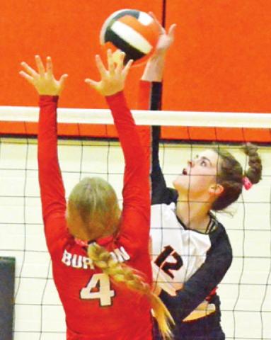 HALLE STEVENS tries to hit the ball past a Burton blocker during Somerville’s home loss to Burton last Friday night.