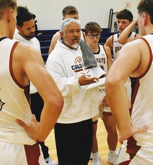 RENE CANTU, Caldwell’s new head coach, talks to players during a timeout against Somerville. Tribune photo by Roy Sanders